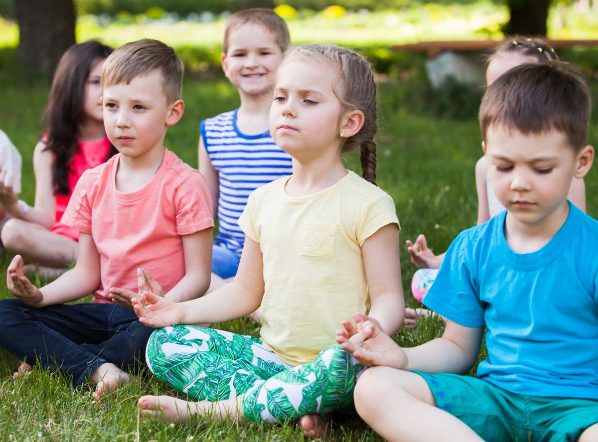 children meditating group mindfulness contemplation